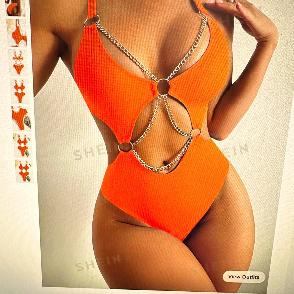 Orange one piece bathing suit with cut outs and chain detail